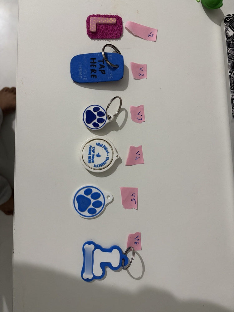 Six versions of the VitalPaws tag in a row, V1 to V6. The Gen 5 is V5, the round one with the paw