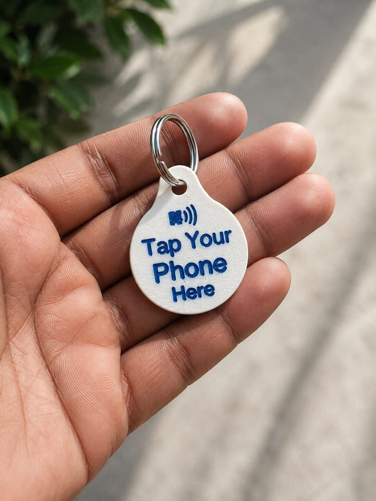 3D-printed NFC tag with Tap Your Phone Here text, held in hand