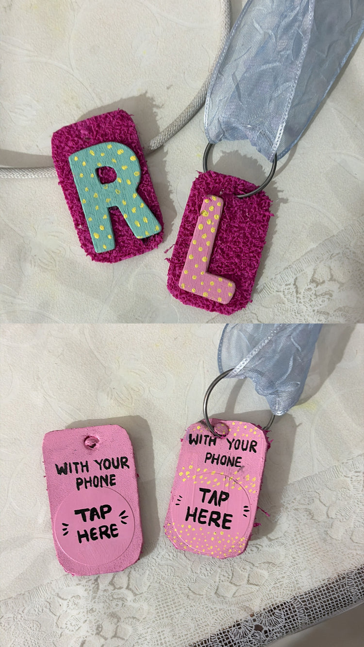 Hand-painted R and L tags on their ribbons