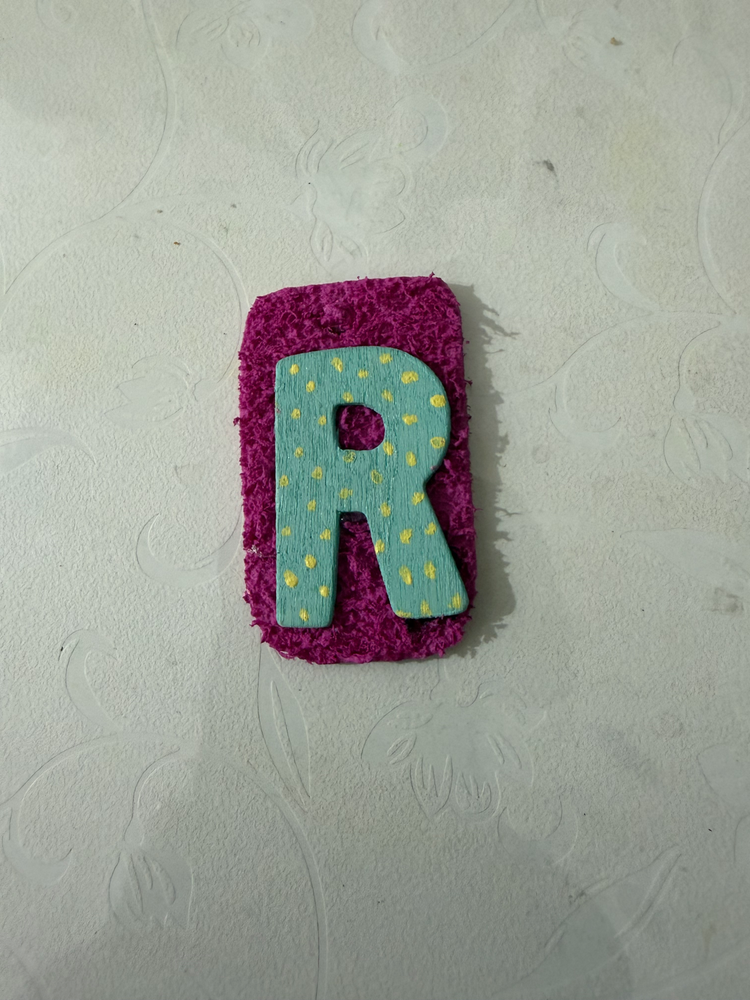 Hand-painted R tag, close up