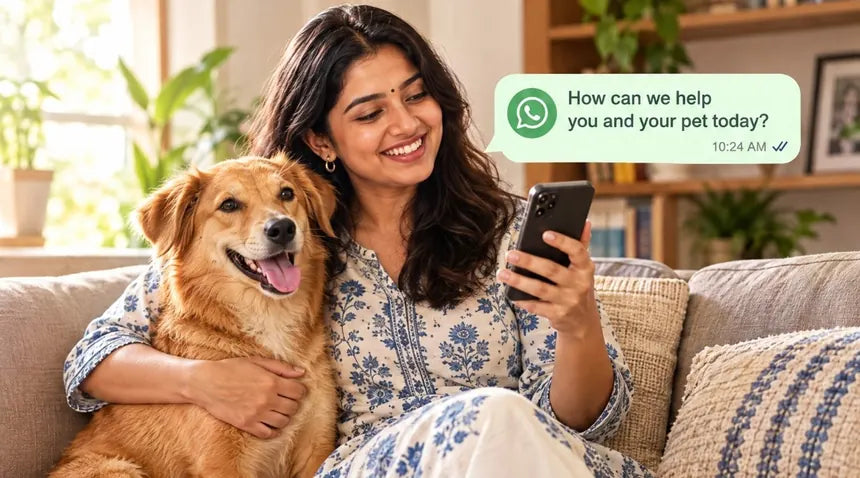A woman on a sofa with a dog, chatting with a Pet Care Expert on WhatsApp